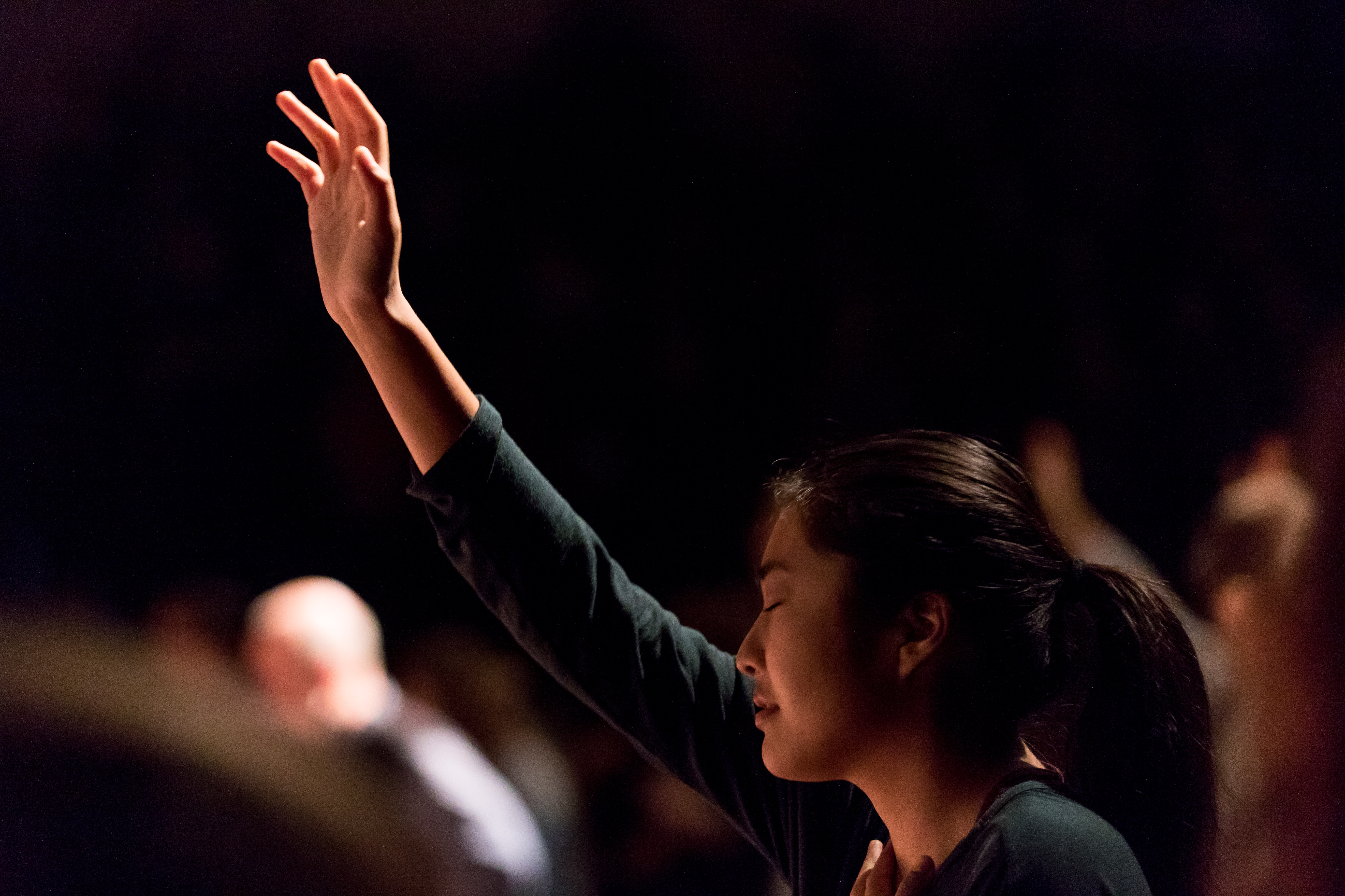 woman worshiping at chapel