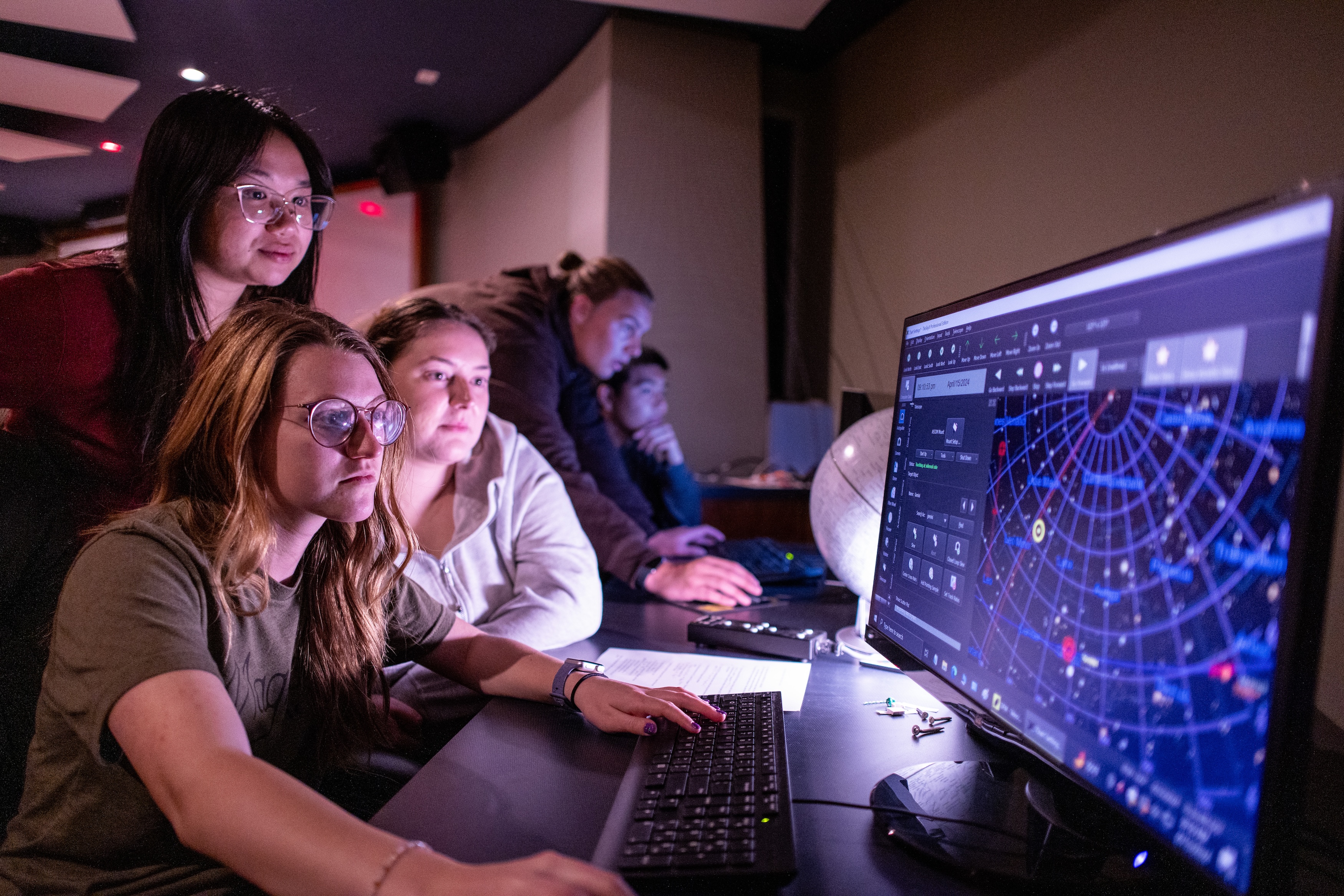 Astrophysics Minor students looking at data on computer