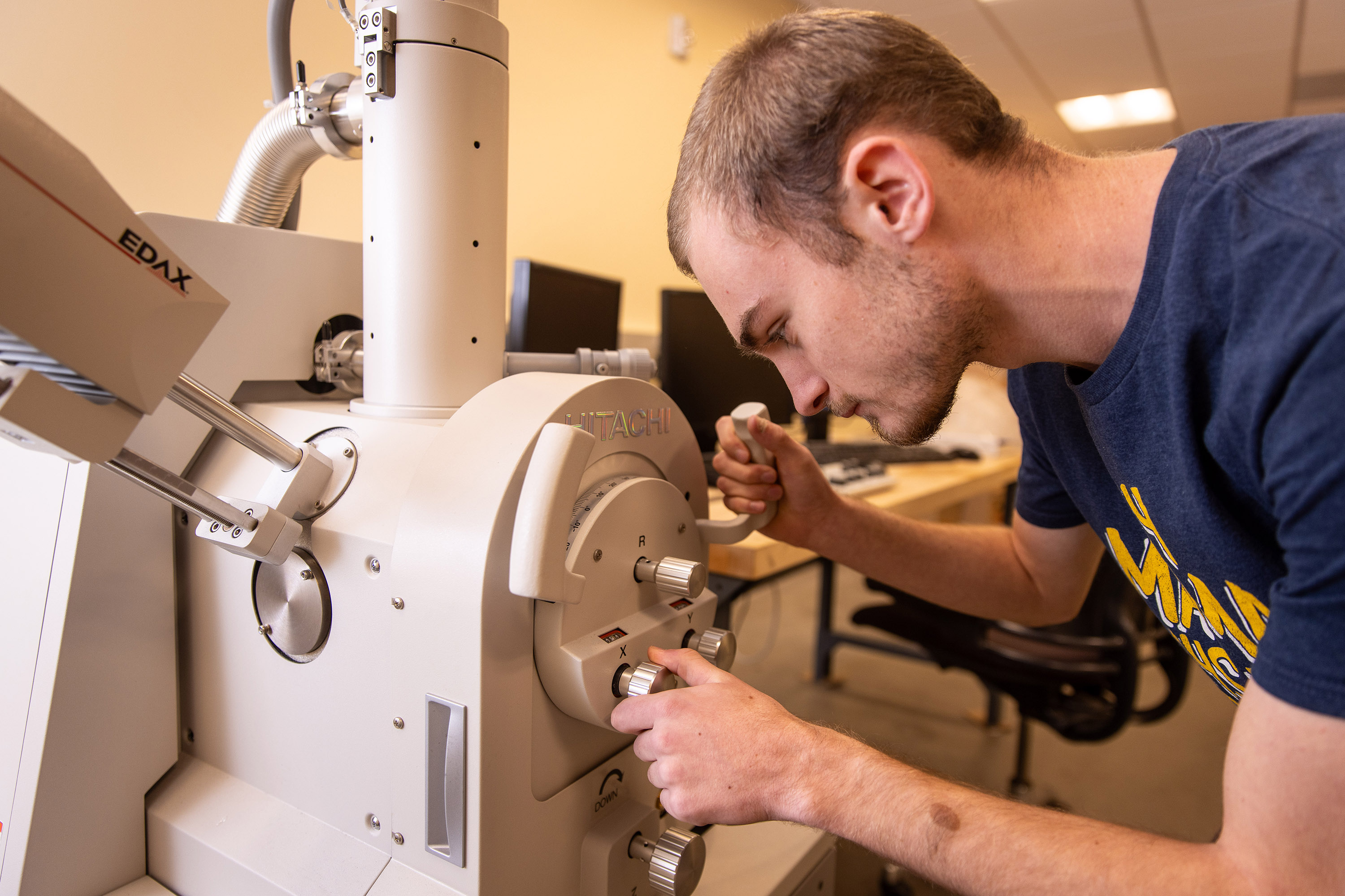 Student Ian Lowry uses the new microscope