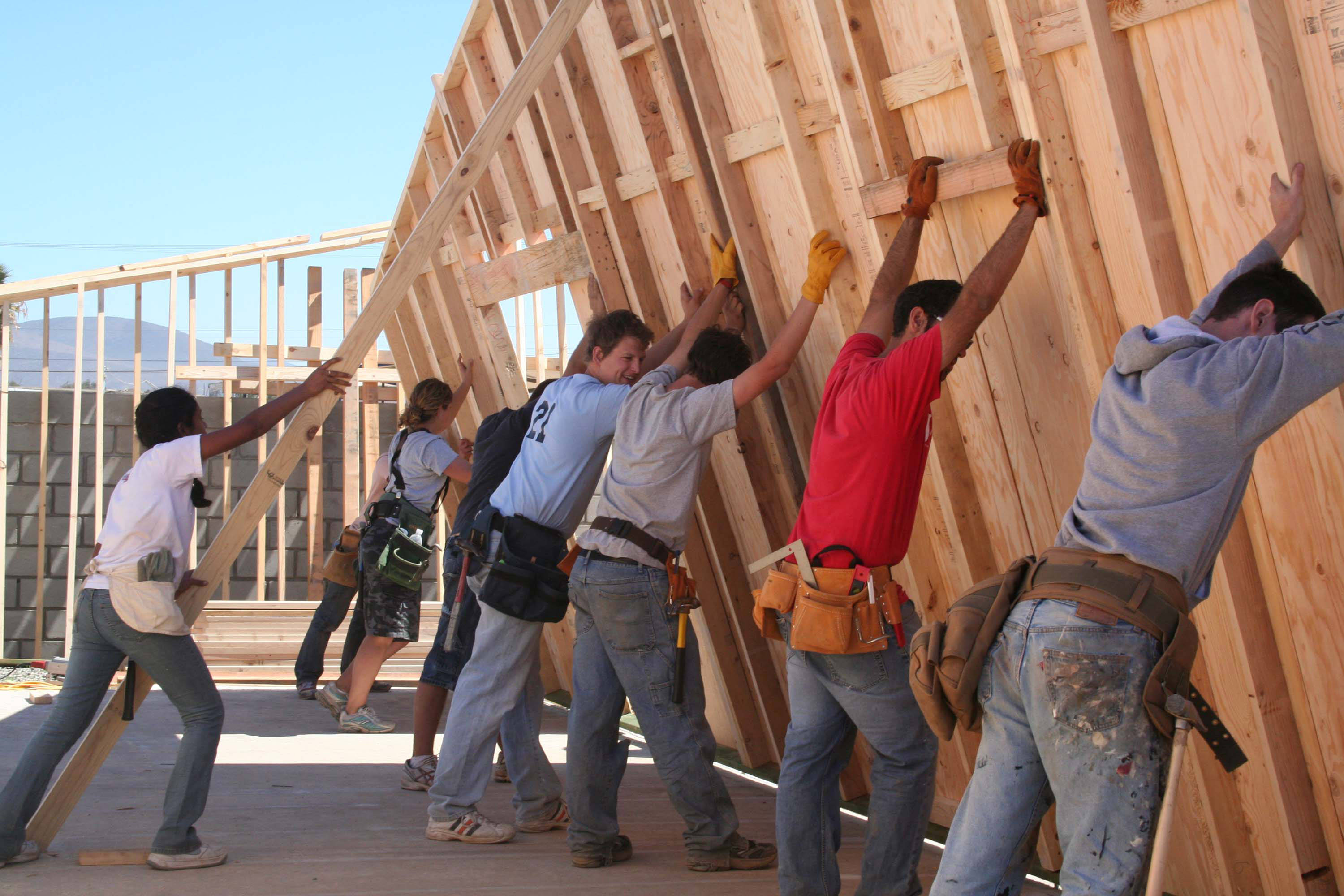 Potter's Clay workers putting up a wall