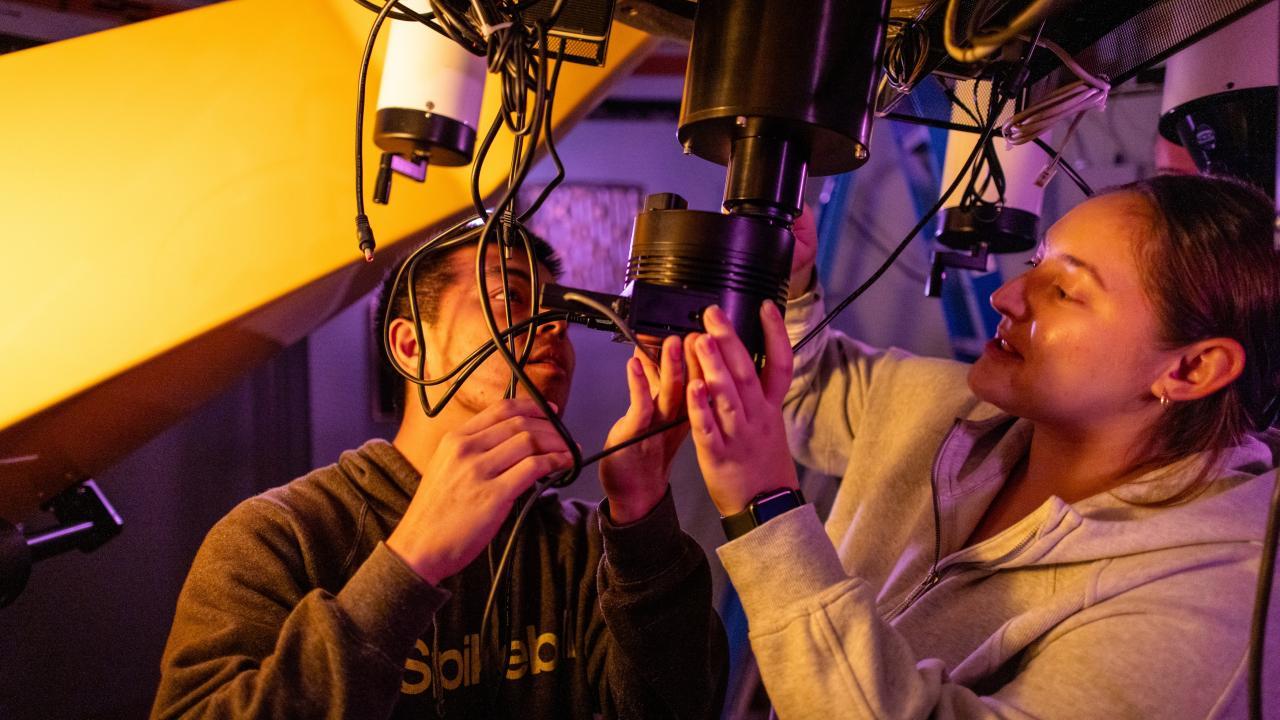 Astrophysics Minor students checking wires